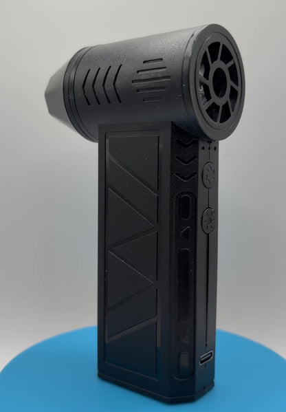 Rechargeable Mini Turbo Air Duster With LED Light rotating on a blue pedestal
