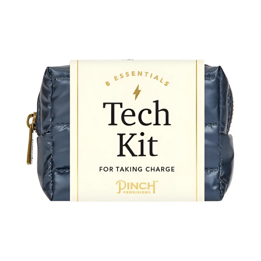 Navy blue quilted tech kit with gold zipper and branding label