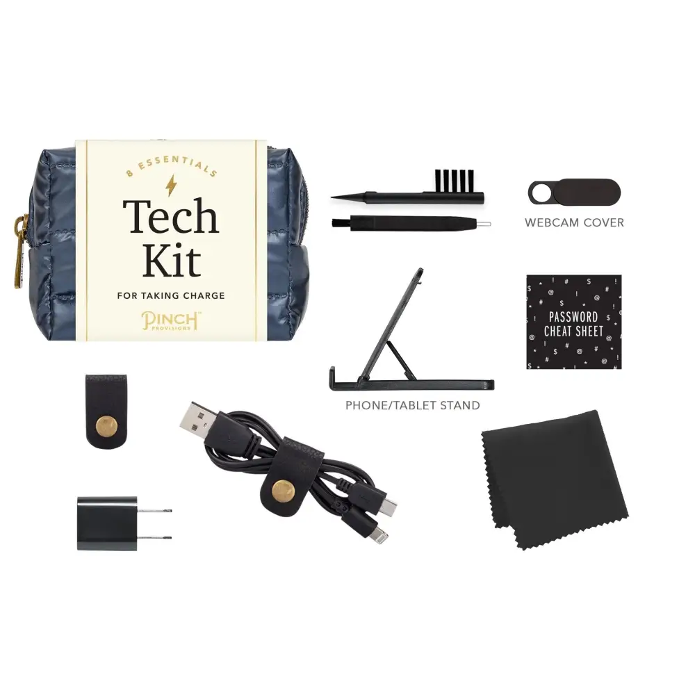 Navy blue quilted pouch with gold zipper and cream-colored label reading ’tech kit for taking charge’ by pinch products.
