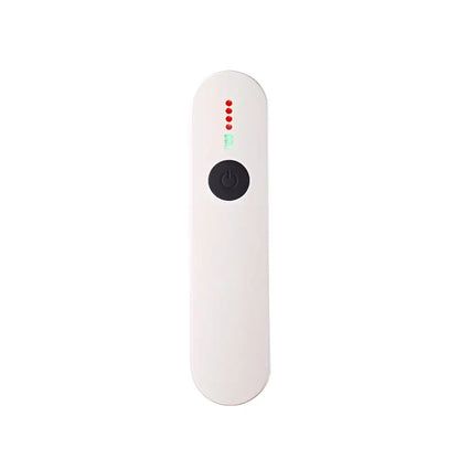White handheld device with a black power button and four red indicator lights above it.
