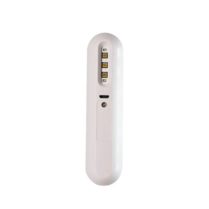 White, sleek, handheld device with a usb-c port and four gold-colored connectors.
