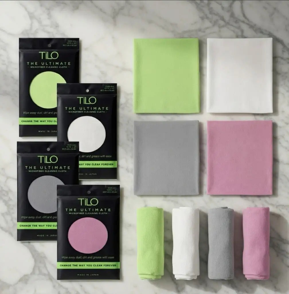 Set of tilo microfiber cleaning cloths in lime green, white, gray, and pink.