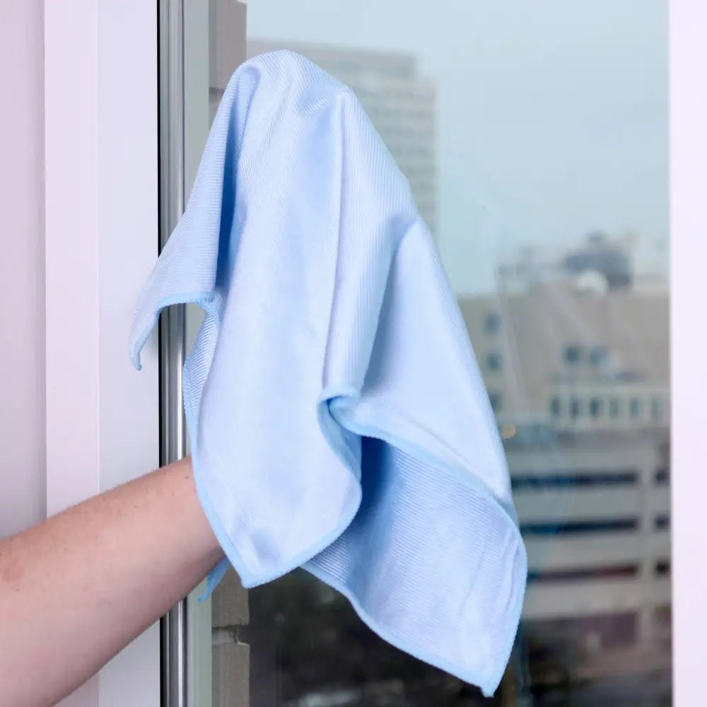 Light blue microfiber window cleaning cloth.