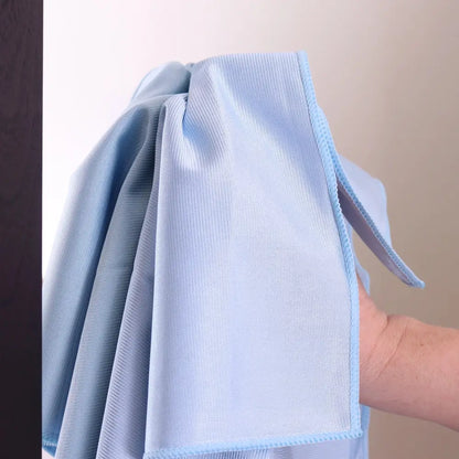 Light blue microfiber cleaning cloth with a soft, textured surface and neatly stitched edges.