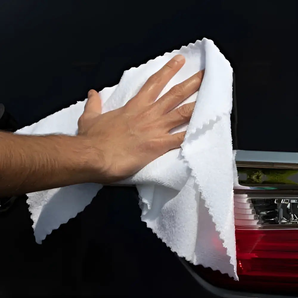 White microfiber car cleaning cloth with scalloped edges.