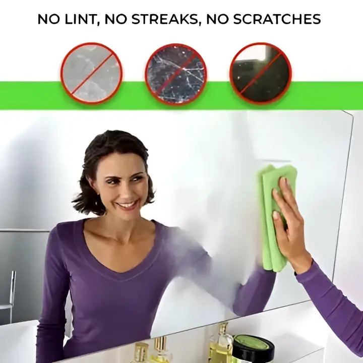 A woman uses a green tilo microfiber cleaning cloth to wipe a reflective glass surface streak-free and lint-free