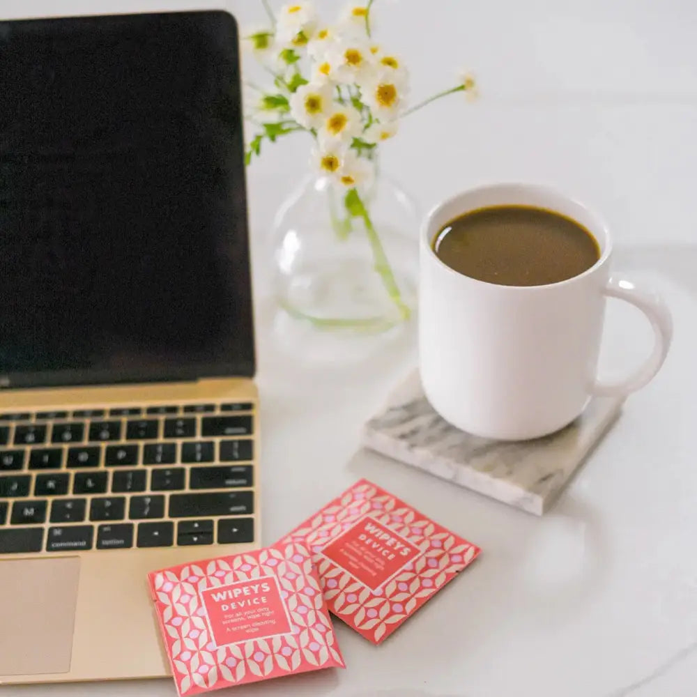 Pink geometric-patterned wipeys device travel wipes packets.